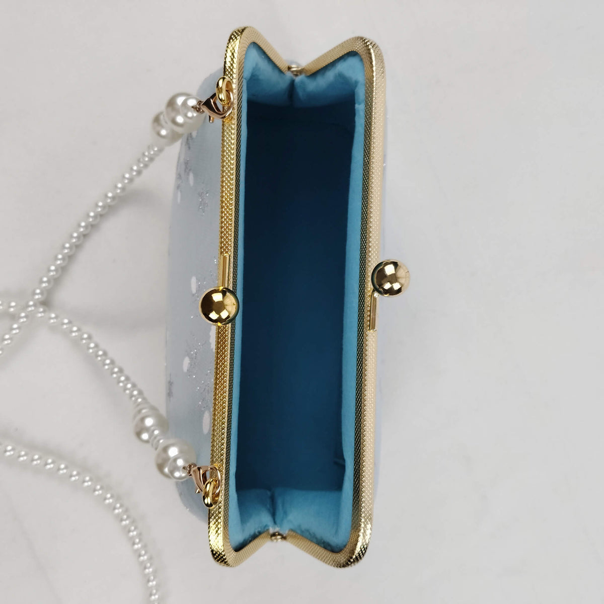 Interior view of Acever A002 snowflake clutch bag showing smooth fabric-lined interior with ample space for phone cards keys and cosmetics