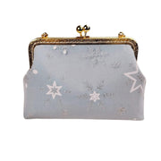 Acever A002 snowflake and star embroidered kiss-lock clutch bag main product shot showing powder blue polyester body with silver glitter snowflakes white star embroidery and gold ornate filigree frame on white background