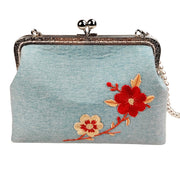 Acever A003 cherry blossom embroidered kiss-lock clutch bag main product shot showing powder blue linen-texture polyester body with red and cream floral embroidery and silver ornate filigree frame on white background