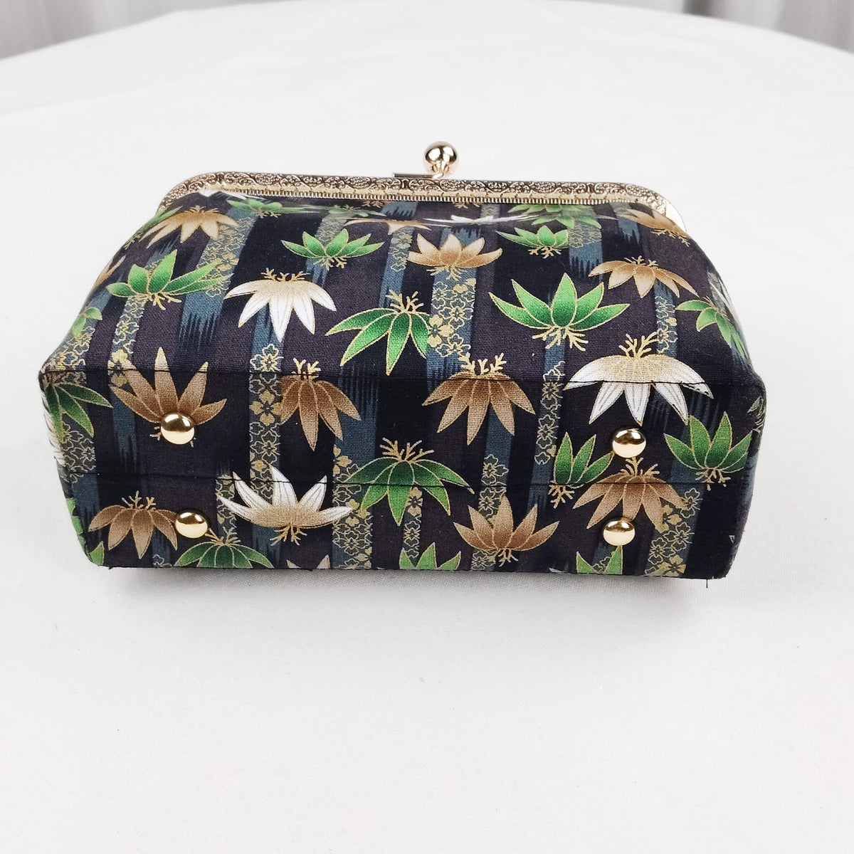 Bottom view of Acever B002 lotus and leaf jacquard clutch bag showing midnight navy jacquard base with lotus and leaf all-over print and metallic gold thread highlights