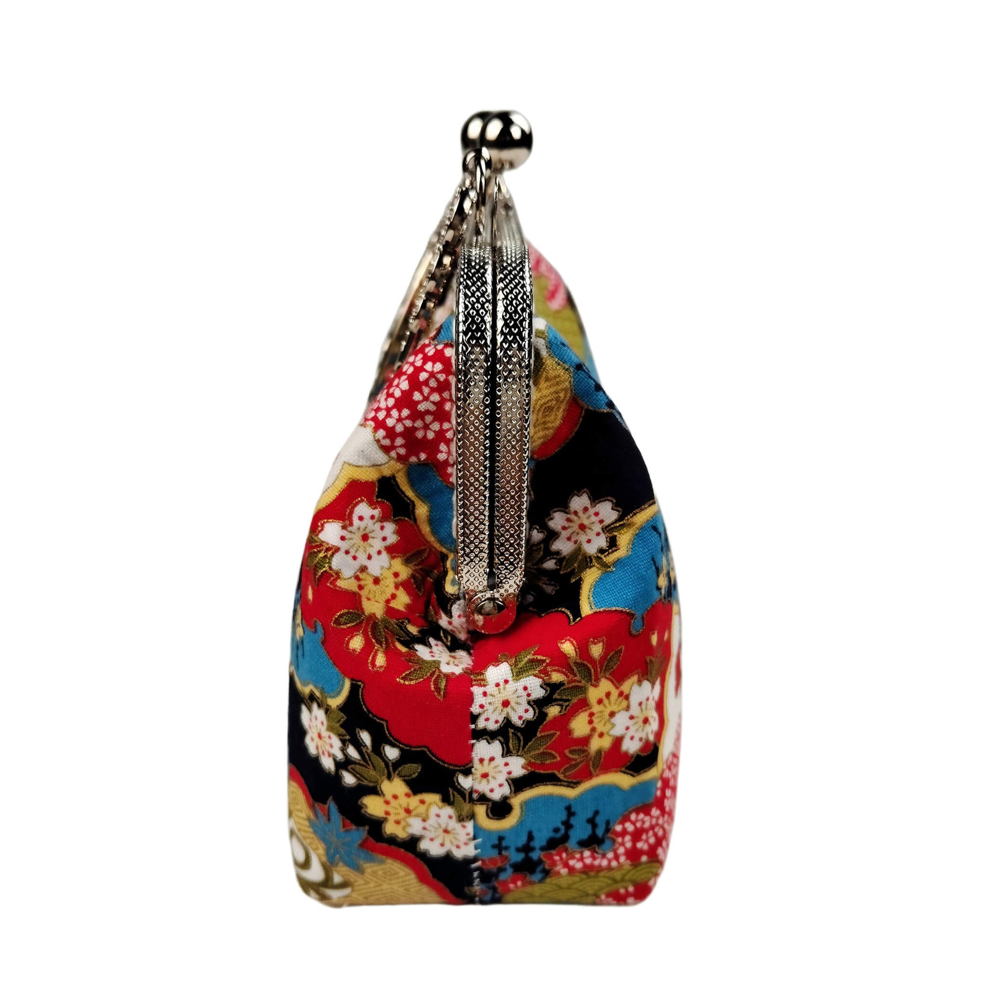 Side view of Acever B003 Japanese Nishiki brocade top handle bag showing black base with teal red gold brocade print silver textured zipper side detail and antique silver top handle with triple floral medallion connectors