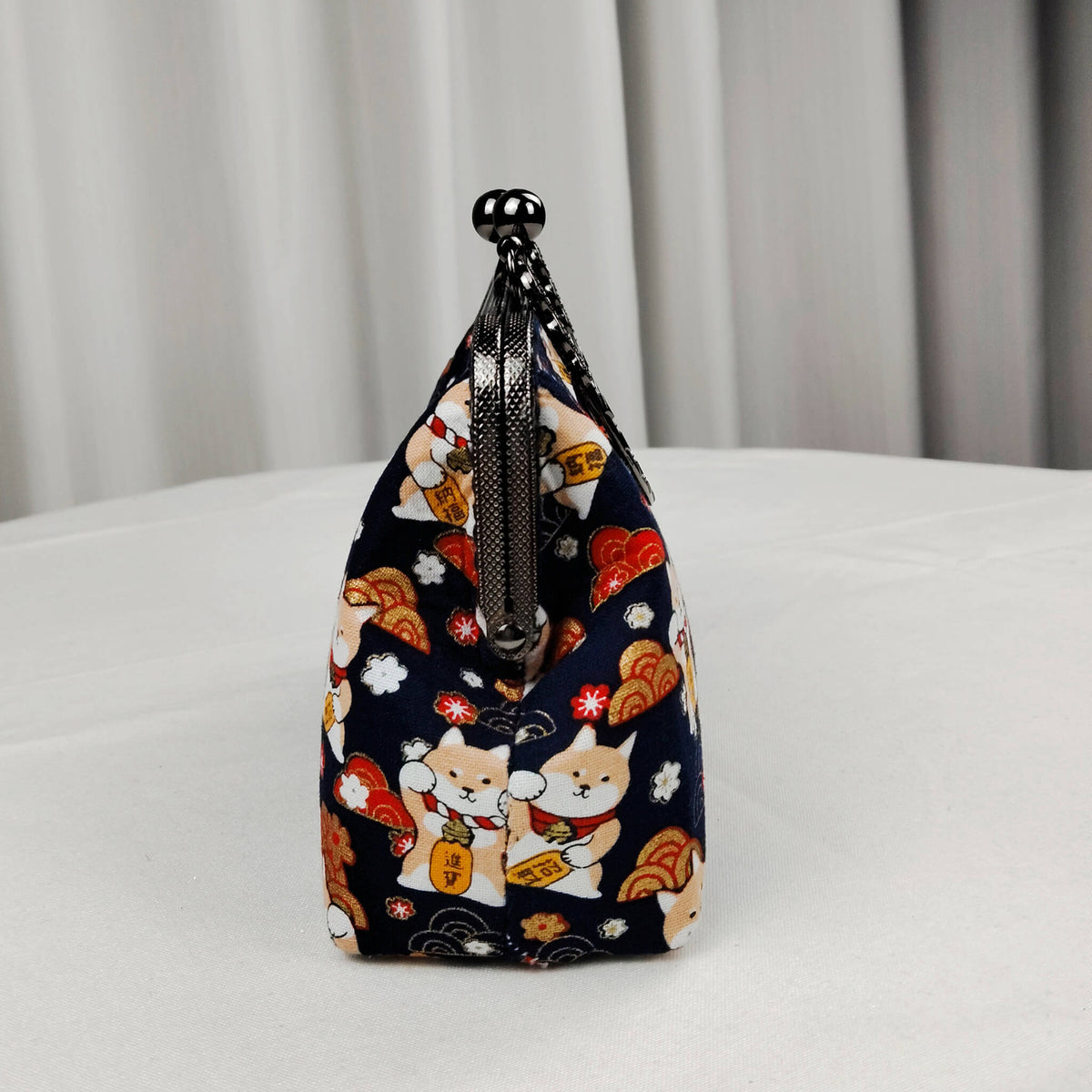 Side view of Acever B005 Lucky Shiba Inu top handle bag showing midnight navy polyester gusset with Shiba Inu and blossom print gunmetal textured zipper side detail and blush pink woven chain strap