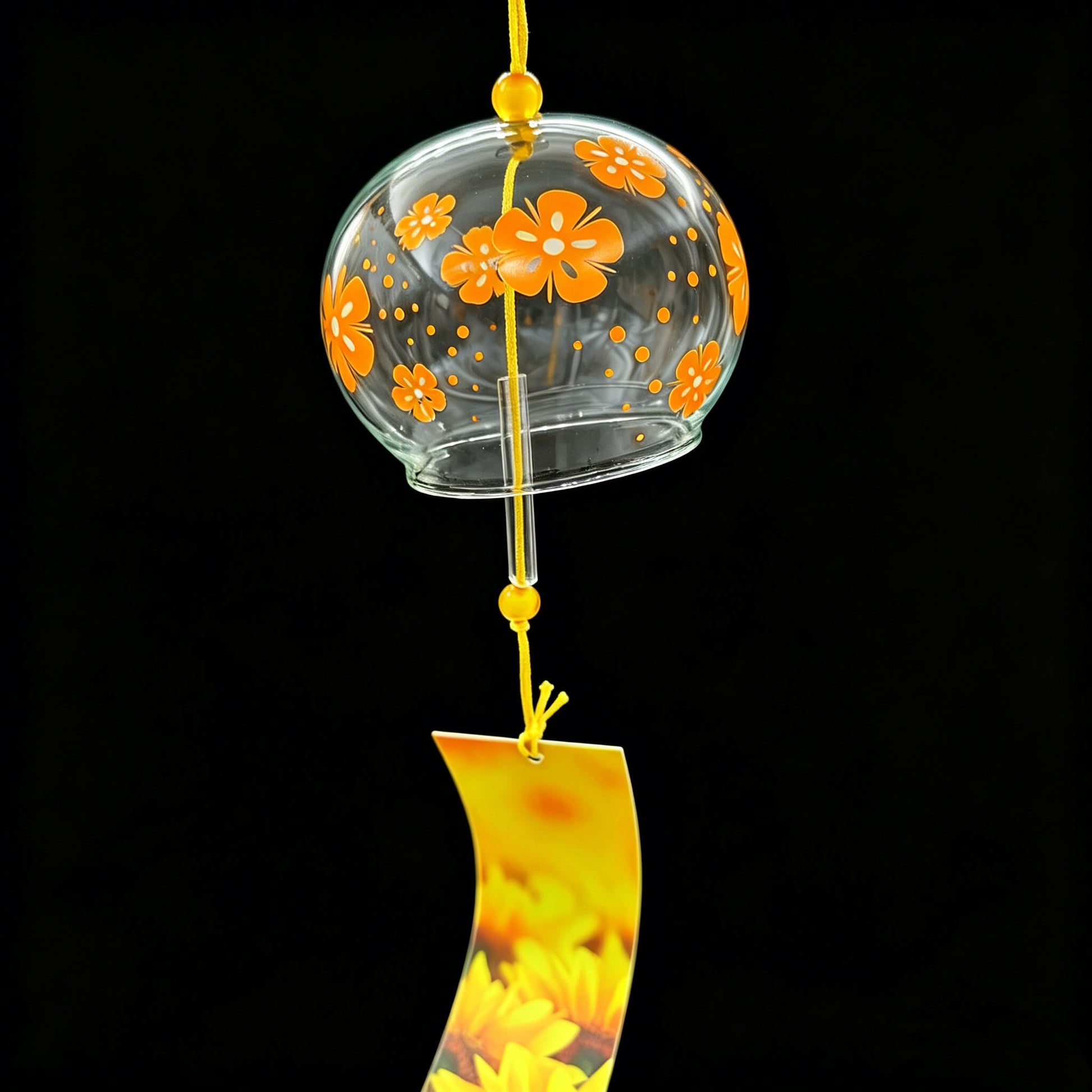 Acever golden flower glass wind chime X04 hanging against black background showing clear globe with orange blossoms and sunflower tag