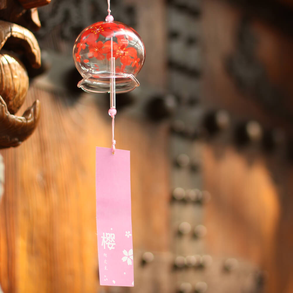 Acever red sakura waved-edge glass wind chime X06 hanging from wooden beam in traditional setting with pink sakura paper strip and 「桜」kanji