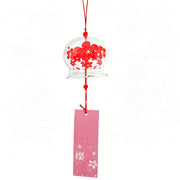 Main product shot of Acever Japanese furin glass wind chime X06 with red sakura blossoms on waved-edge clear globe and pink sakura paper strip on white background
