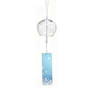 Main product shot of Acever Japanese furin glass wind chime X07 with white snowflake design on clear flat-rim globe and blue snowflake paper strip on white background