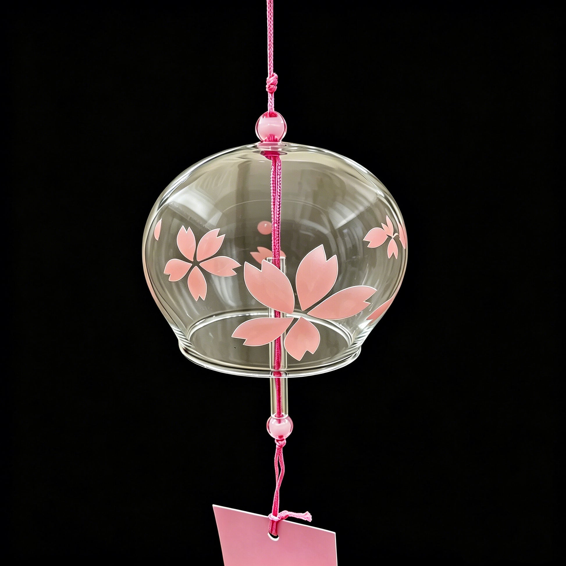 Close-up of Acever pink sakura glass wind chime X09 showing flat-rim clear globe with soft pink cherry blossom pattern and pink cord