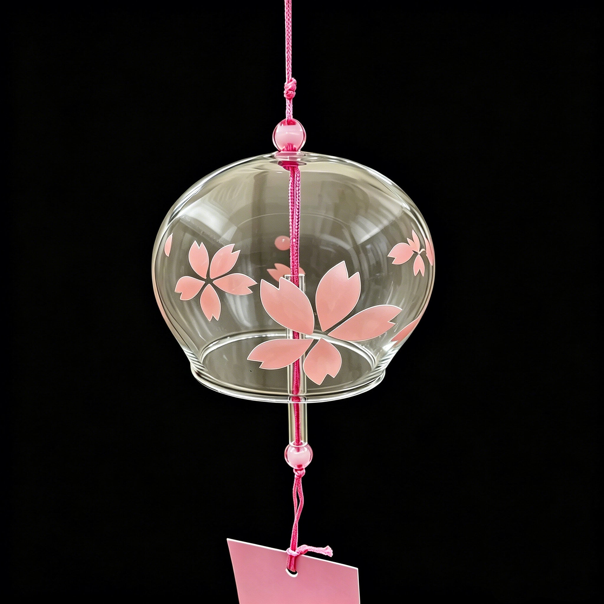 Close-up of Acever pink sakura glass wind chime X09 showing flat-rim clear globe with soft pink cherry blossom pattern and pink cord