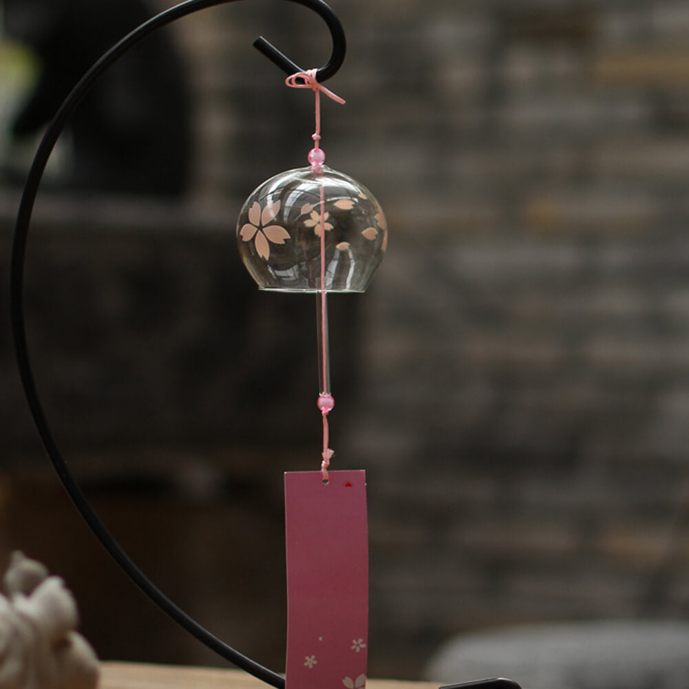 Acever pink sakura glass wind chime X09 on display stand showing flat-rim clear globe with pink sakura petals and deep rose paper strip