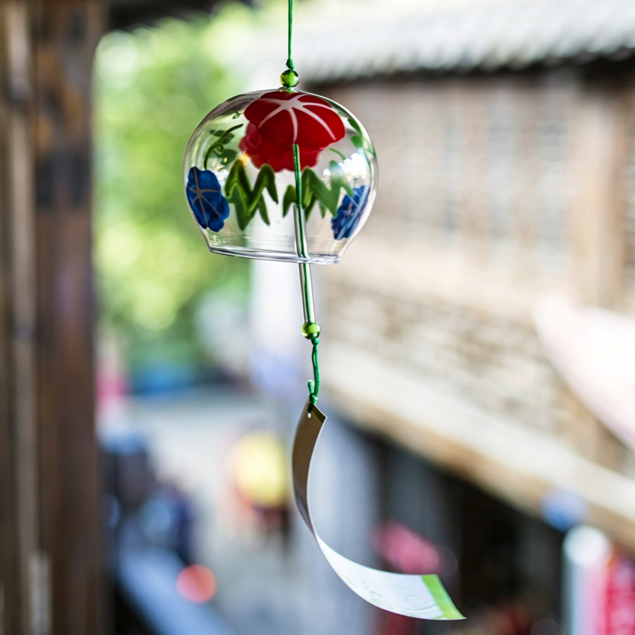 Acever morning glory glass wind chime X11 hanging in traditional Japanese street showing red and blue asagao on clear globe