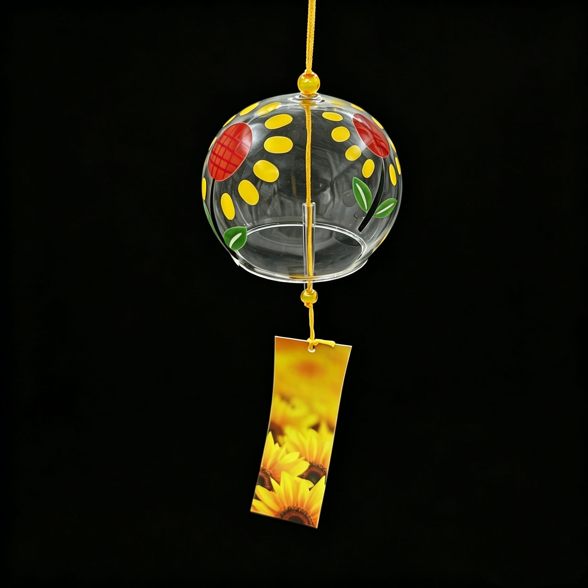 Acever sunflower glass wind chime X13 hanging against black background showing full clear globe with sunflower design and golden sunflower paper strip