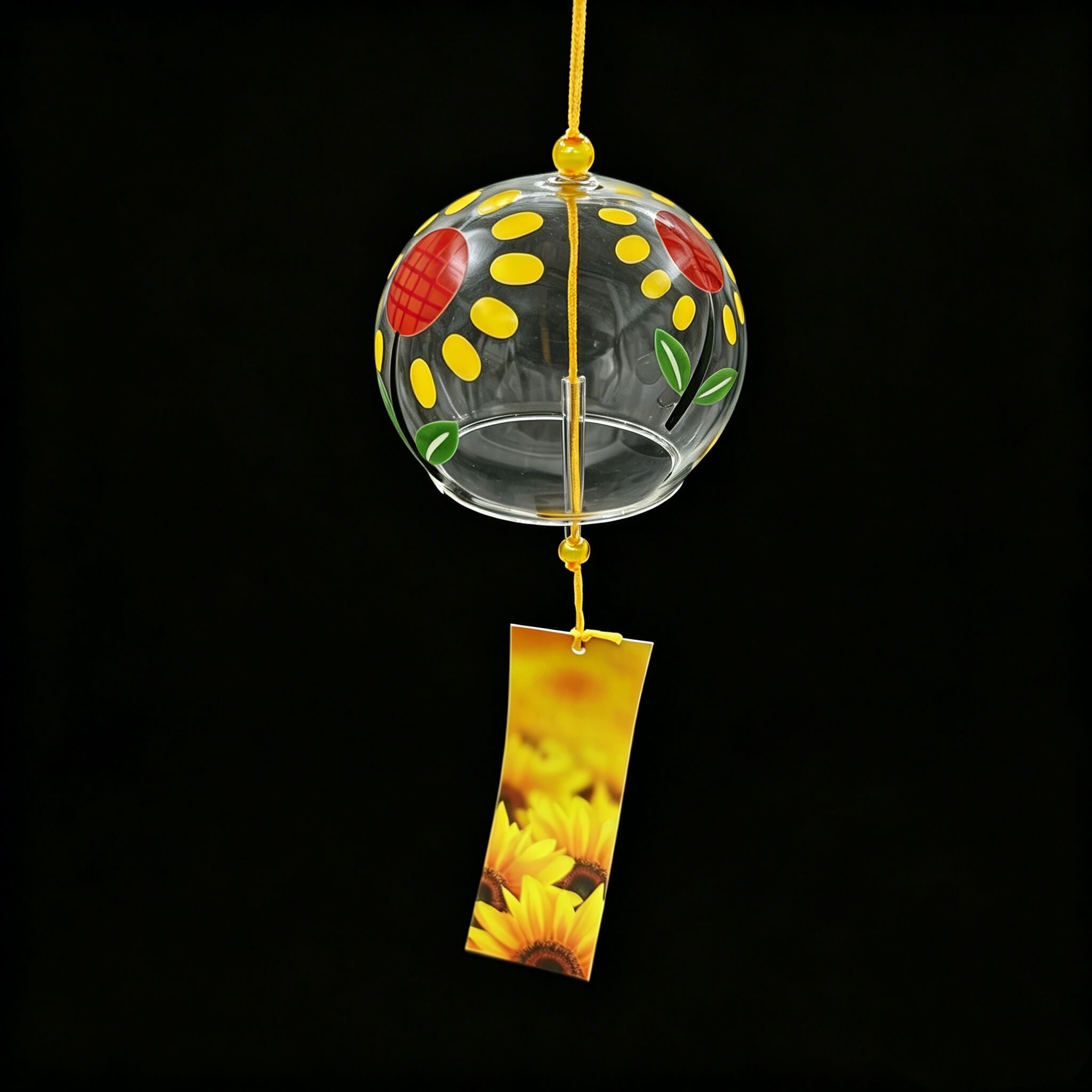 Acever sunflower glass wind chime X13 hanging against black background showing full clear globe with sunflower design and golden sunflower paper strip