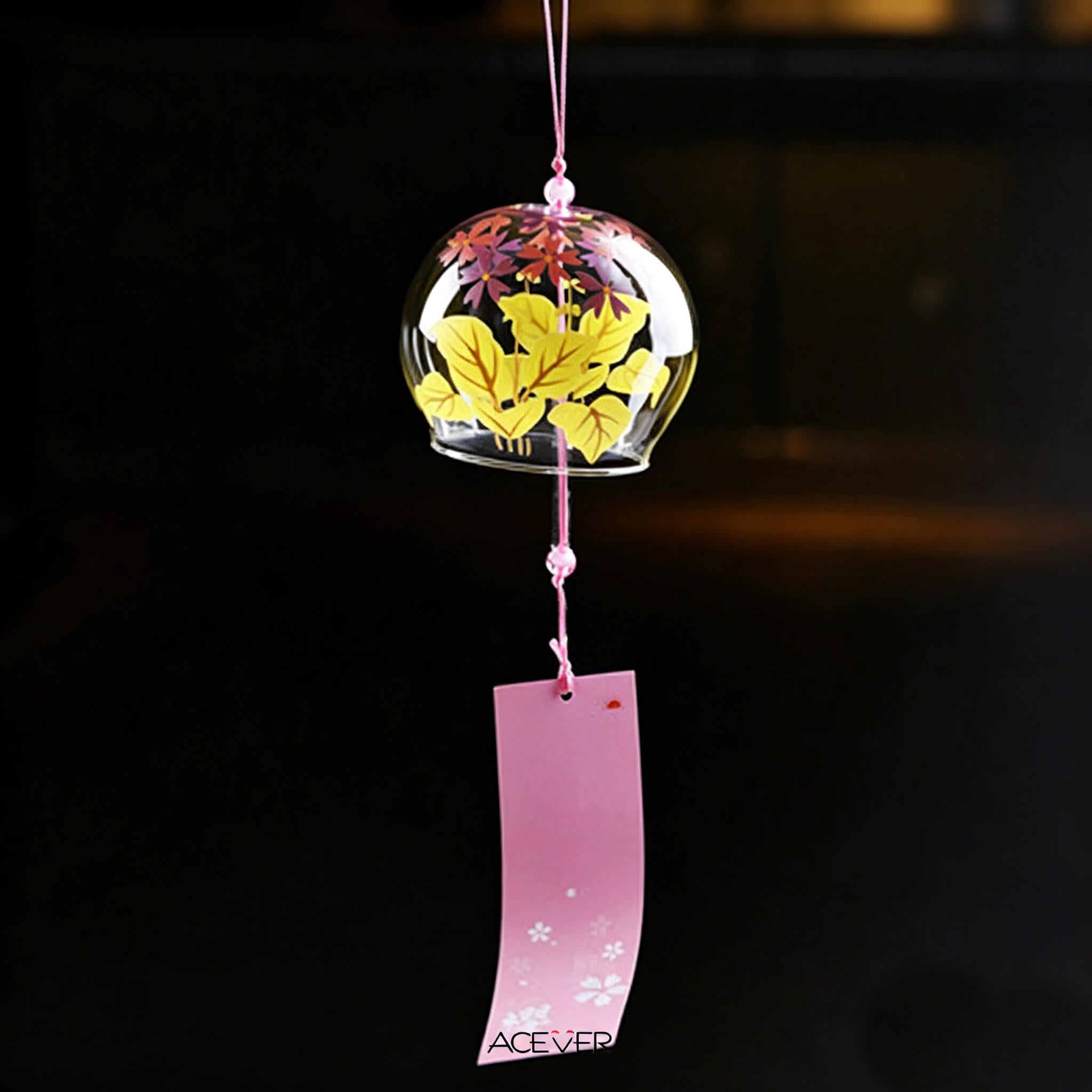Acever autumn maple and sakura glass wind chime X14 hanging against black background at night showing golden maple leaves and pink crystal beads glowing
