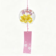 Main product shot of Acever Japanese furin glass wind chime X14 with golden maple leaves and purple star blossoms on clear globe and pink sakura paper strip on white background