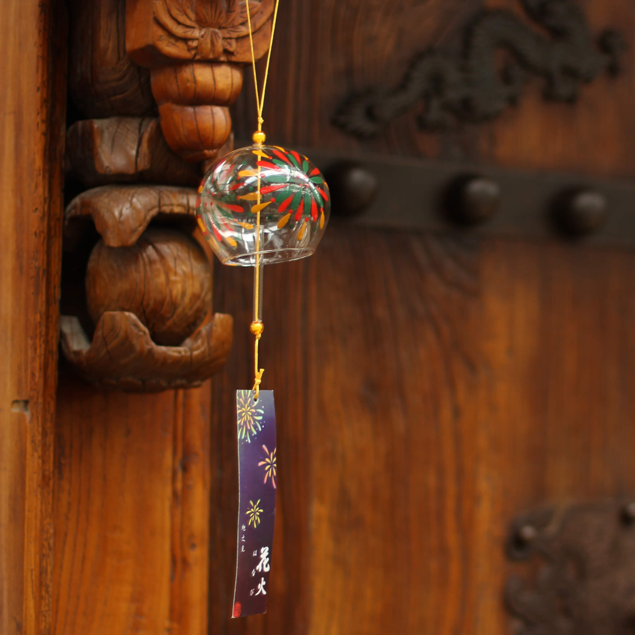 Acever fireworks hanabi glass wind chime X18 hanging from traditional Chinese pavilion eave with navy fireworks paper strip swaying