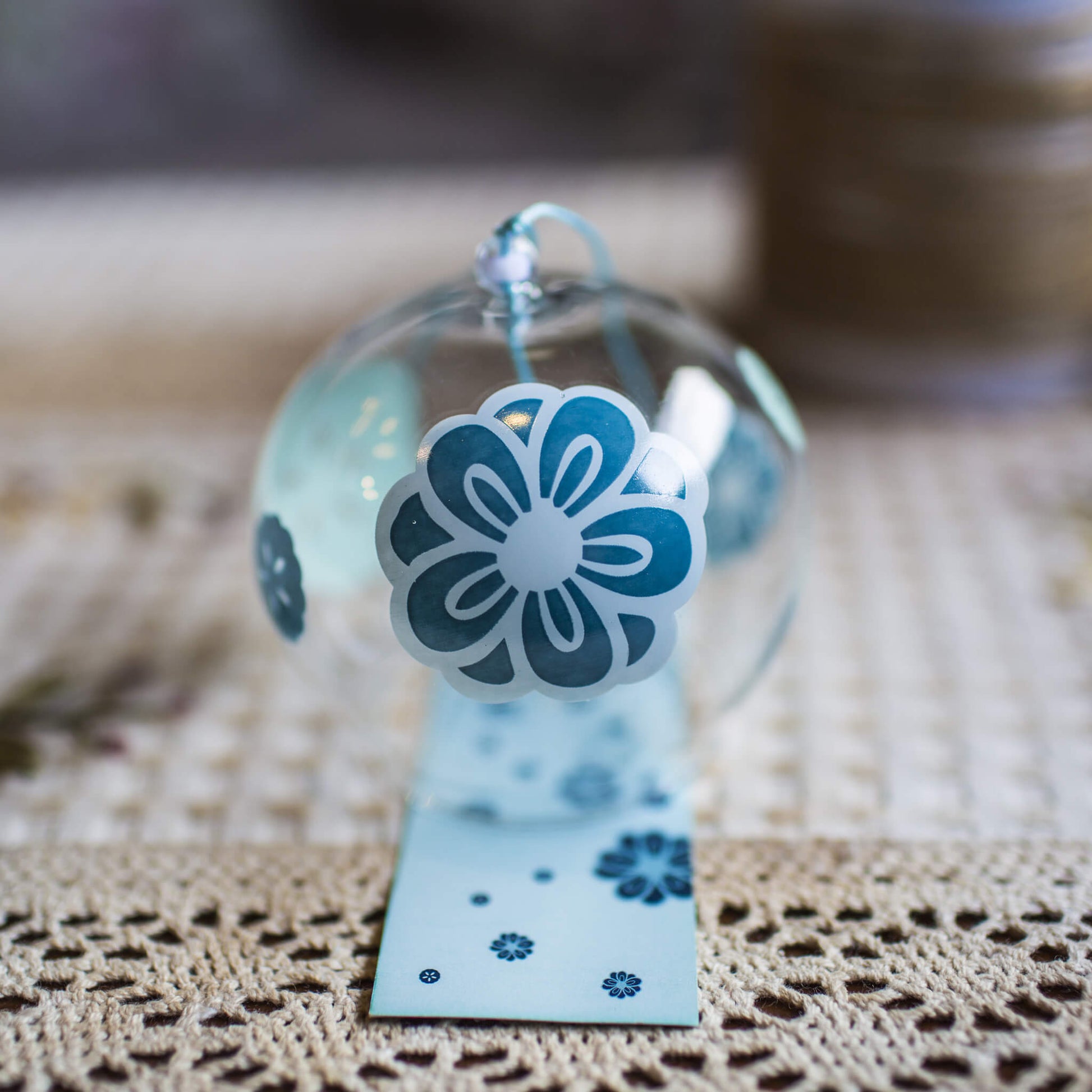 Acever teal plum blossom glass wind chime X19 showing clear globe with teal ume blossoms and dark slate paper strip