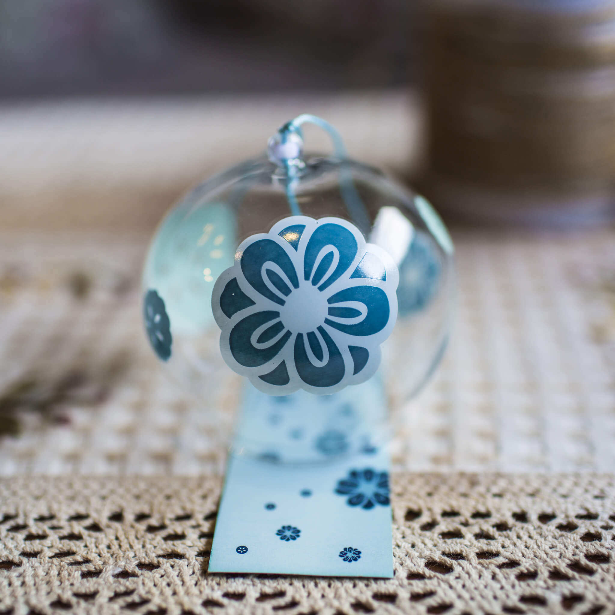 Acever teal plum blossom glass wind chime X19 showing clear globe with teal ume blossoms and dark slate paper strip