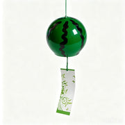 Main product shot of Acever Japanese furin glass wind chime X31 on off-white background showing deep green watermelon globe with black wavy stripes and white paper strip with green botanical vine scroll and butterflies