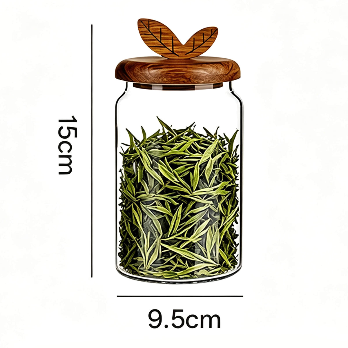 600ml smooth glass jar with leaf handle wooden lid filled with green tea leaves showing 15cm height and 9.5cm width dimensions.