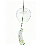 Acever white chrysanthemum glass wind chime X32 hanging in white background showing clear globe with the flower blossom and green vine scroll paper strip