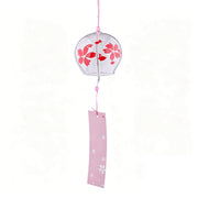 Main product shot of Acever Japanese furin glass wind chime X37 on white background showing clear globe with vivid red sakura cherry blossom blooms and petals with pink cord and pink paper strip with white sakura