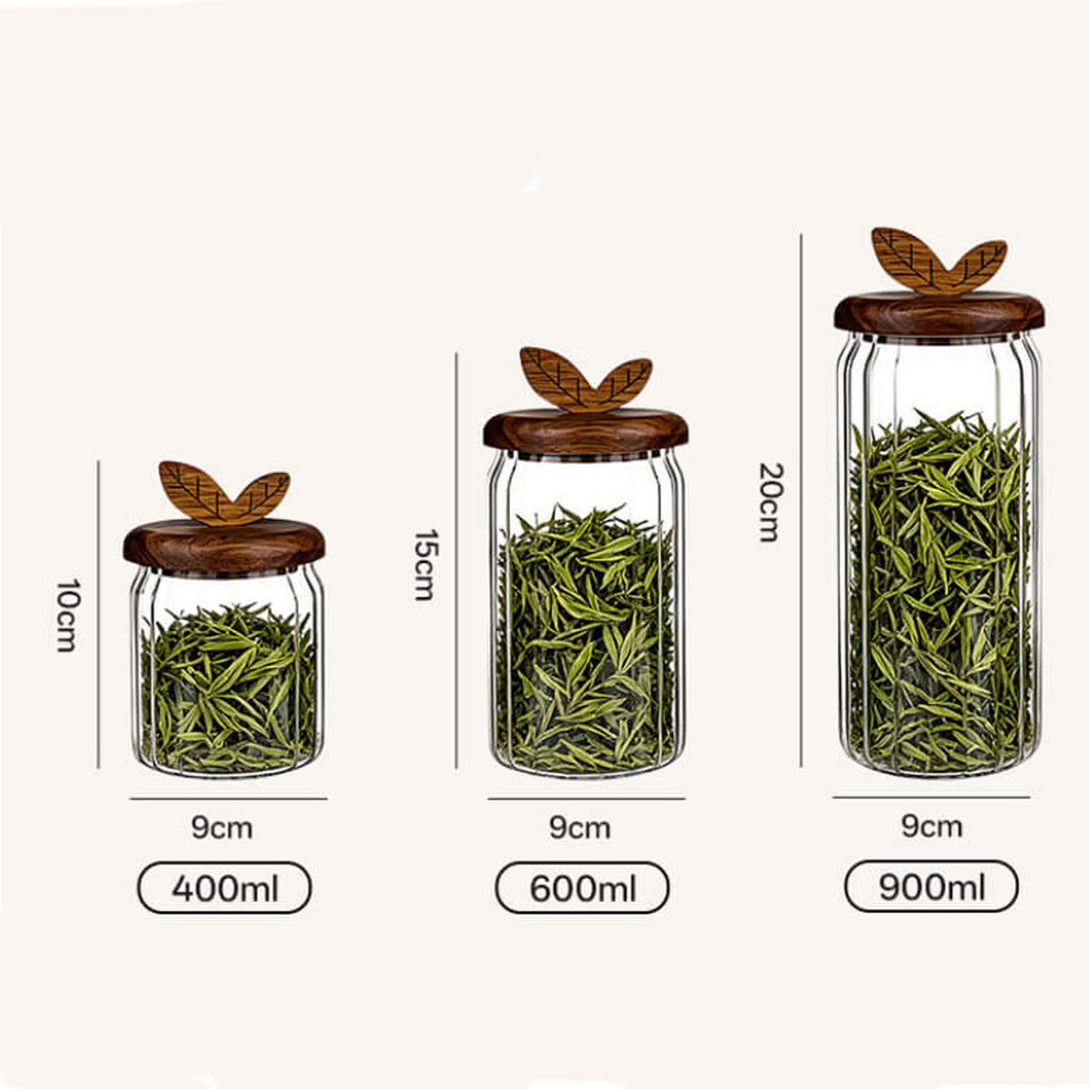Three sizes of ribbed glass jars with leaf handles filled with green tea leaves labeled 400ml, 600ml, and 900ml with dimensions.