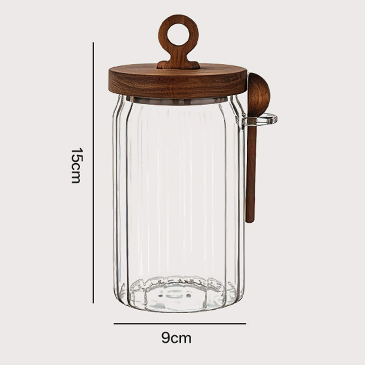 600ml ribbed glass jar with wooden lid and spoon showing 15cm height and 9cm width dimensions.