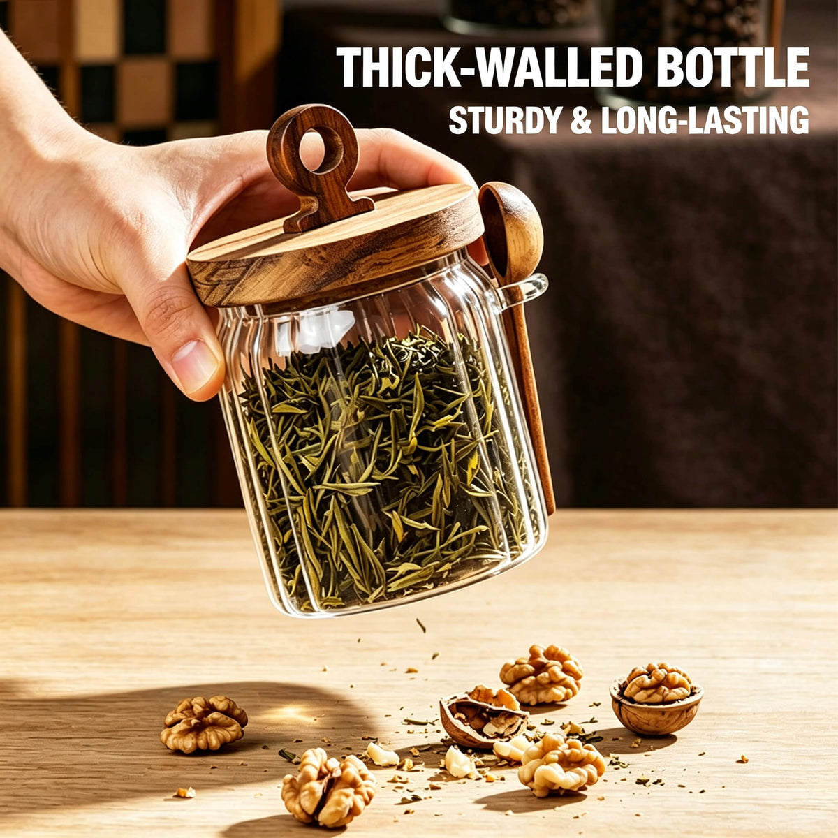 Hands holding coffee cup on table next to ribbed glass jar filled with coffee beans and wooden scoop.